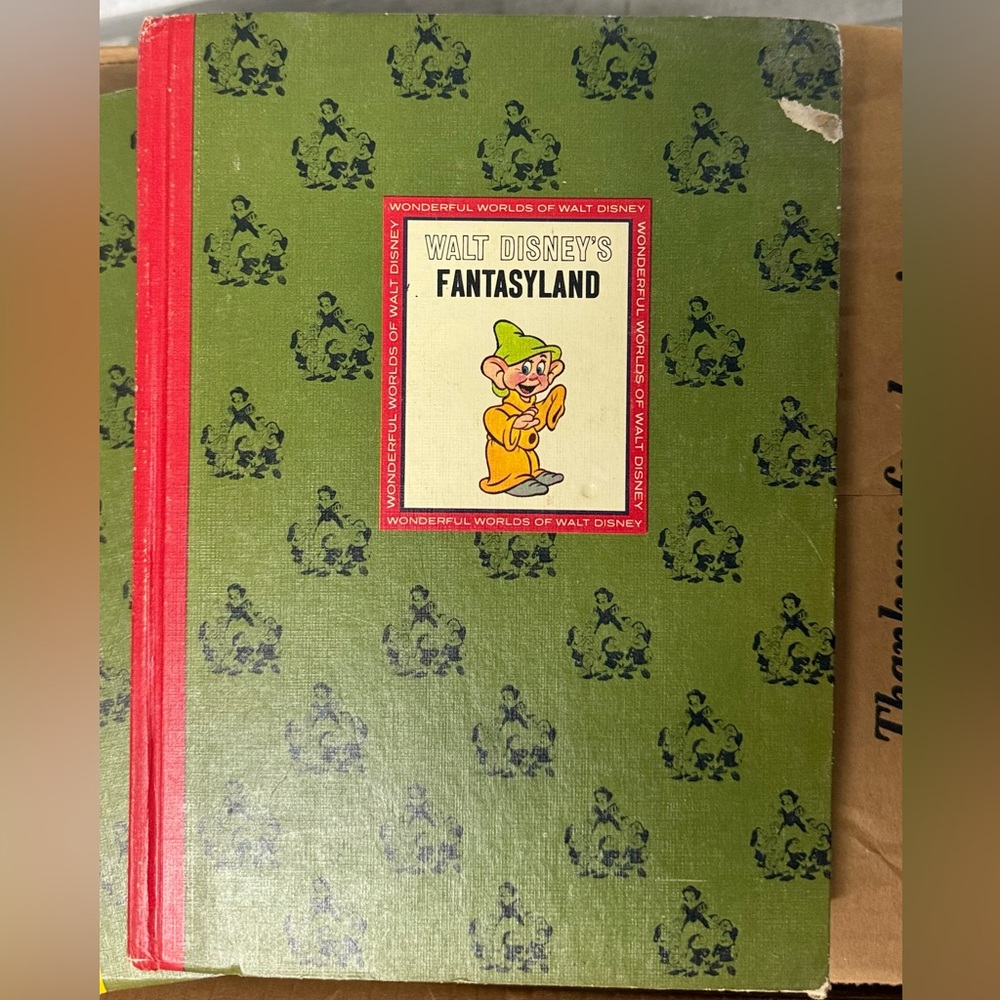 Charming Walt Disney's hard cover 4 book collection - green cover and red spine.